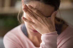 Tired,Young,Woman,Touching Forehead